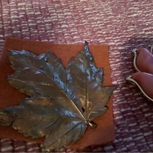 Sarah Coventry leaf motif brooch and metal maple leaf pin